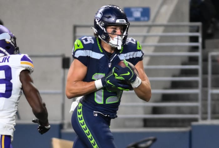Seattle Seahawks wide receiver Jake Bobo (19) runs the ball in for a touchdown past Minnesota Vikings cornerback Andrew Booth Jr. (23) during the second half at Lumen Field.